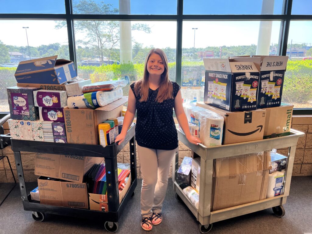CCO Danielle Burton with all the donated school supplies